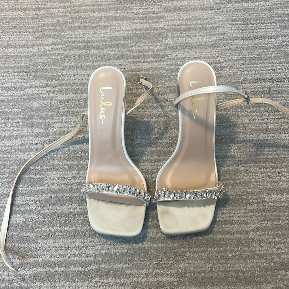 Lulu’s white heel with crystal strap